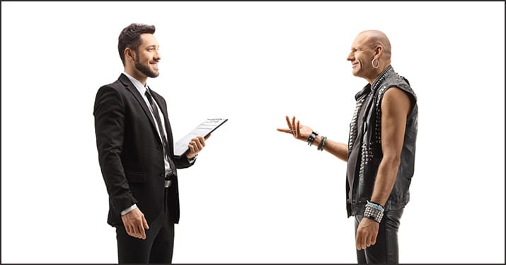 entertainment lawyer talking to leather-clad musician