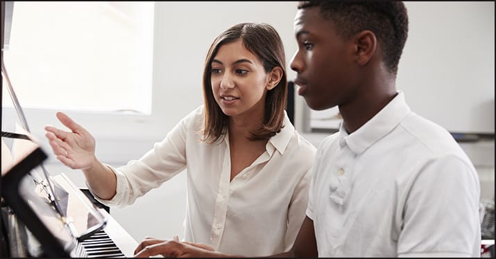 teacher and student during music practice