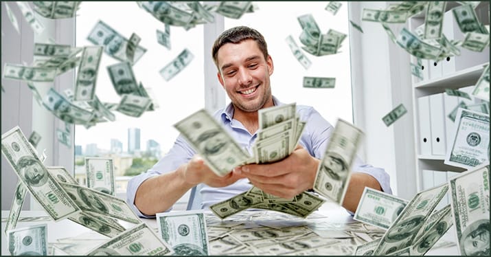 raining money in young man's office