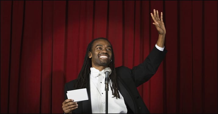 Musician reading out nominations for a Grammy award