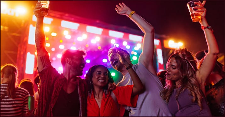 Cheerful crew at a listening party outdoors