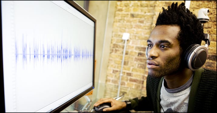 musician placing sample in home studio DAW