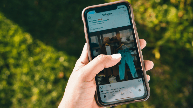 Instagram Features Every Musician Should Use phone above grass on Instagram