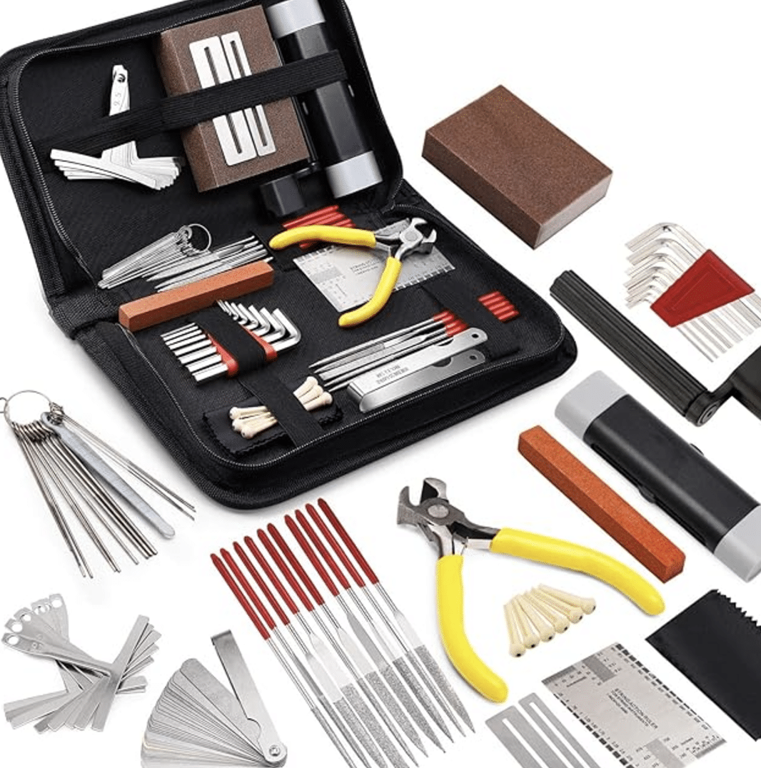 A comprehensive guitar repair kit makes for excellent gift ideas for musicians, featuring various tools like pliers, screwdrivers, sanding blocks, and measurement gauges.