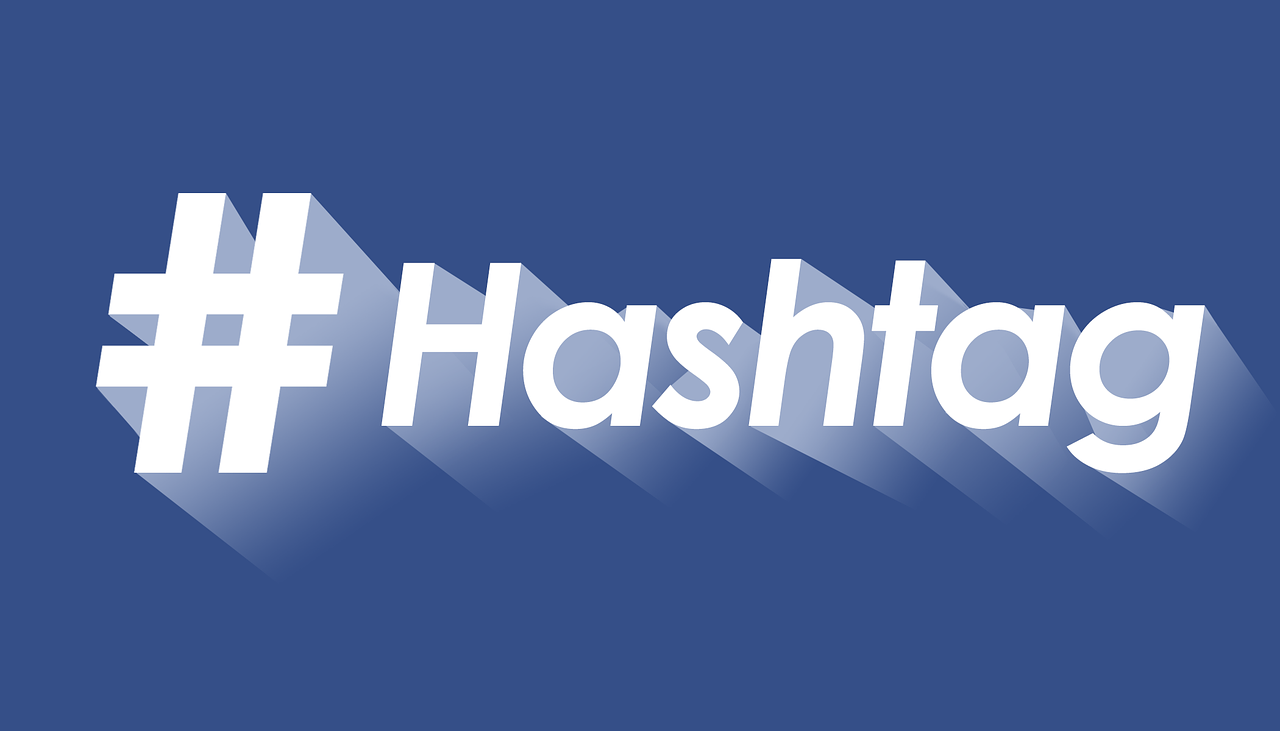 Hashtag symbol with the word "Hashtag" on a blue background, emphasizing social media branding and digital marketing.