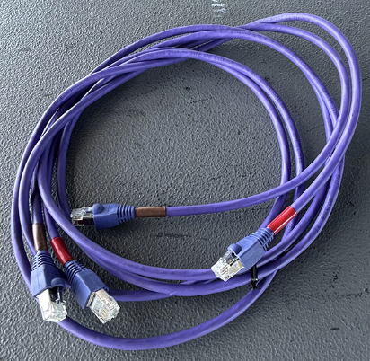 A screen grab of purple CAT5 Cables on a grey background is pictured 