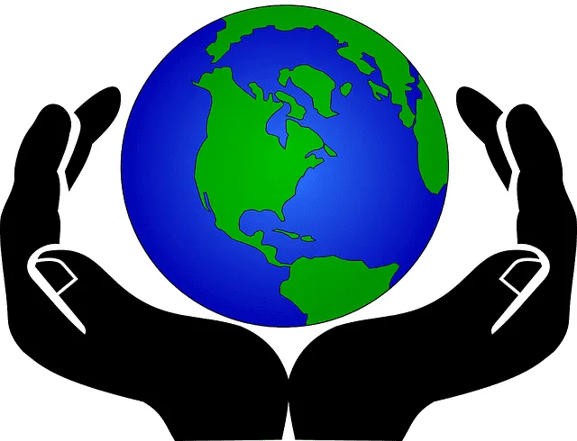 Earth held by two black hands, symbolizing global care and environmental responsibility.