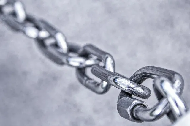 Chain link close-up emphasizing music industry connectivity and digital networking for Hypebot SEO context.