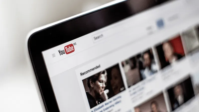 YouTube homepage displaying recommended videos on a tablet screen, focusing on digital content, online video platform, and st