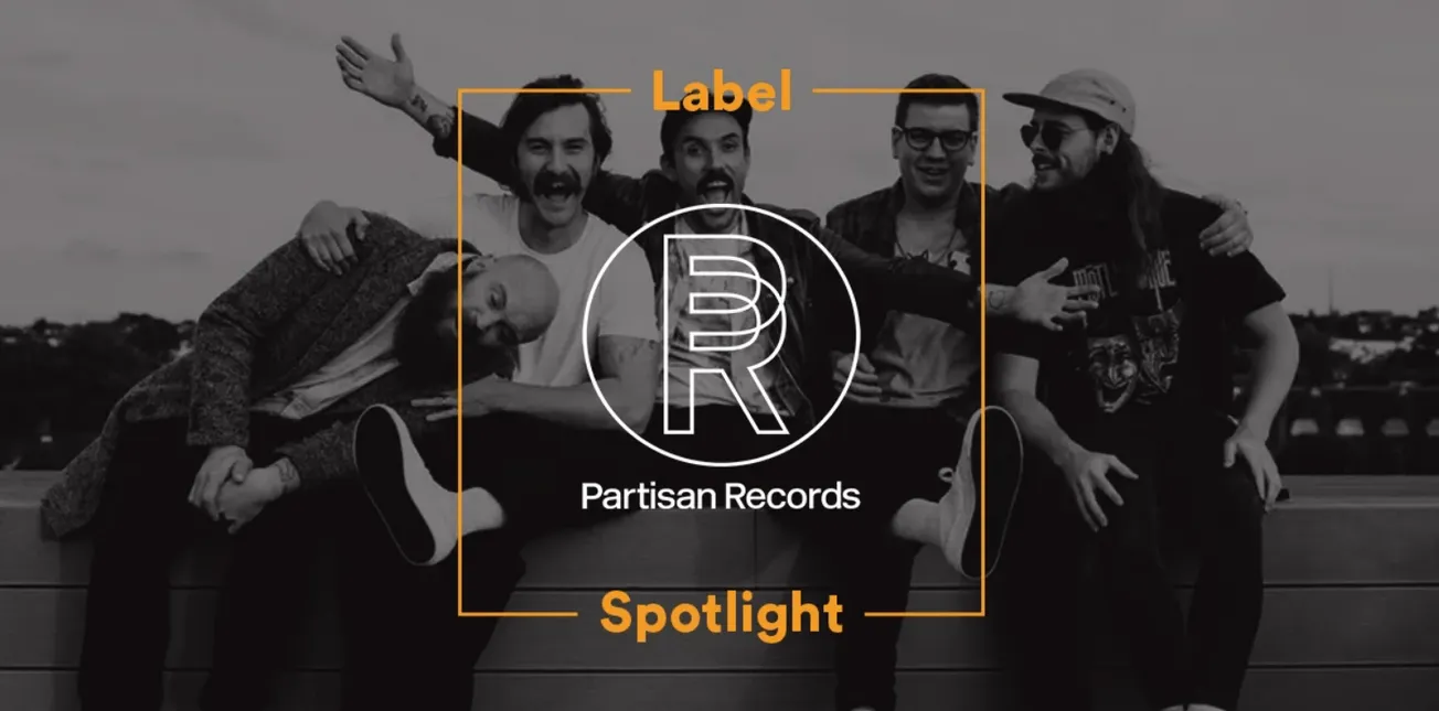 Friends group photo on a rooftop with Partisan Records logo, music branding, and modern entertainment vibe.