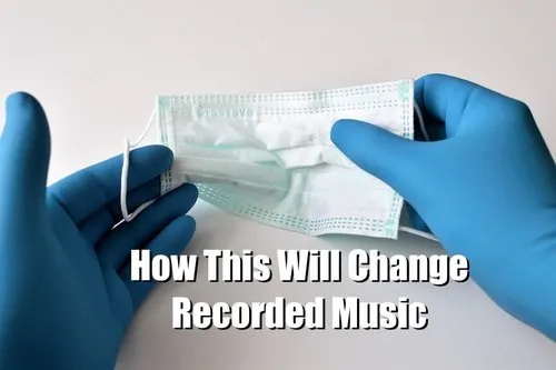 Disposable surgical mask held by gloved hands, emphasizing changes in recorded music due to health and safety regulations dur