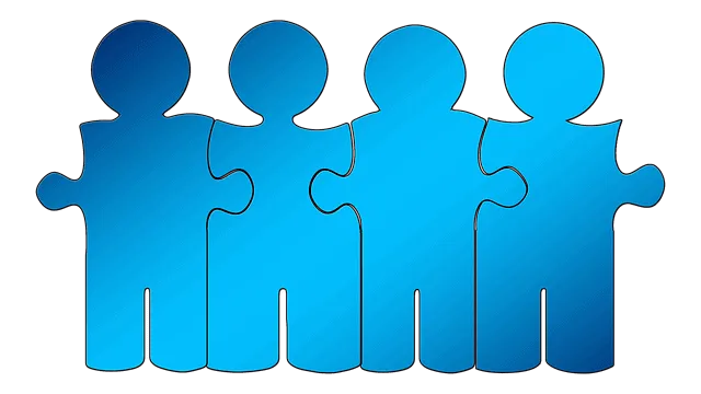 A group of interconnected blue puzzle pieces representing teamwork and collaboration.