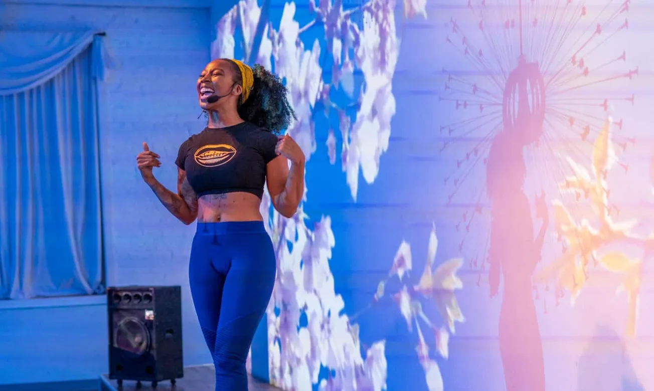 Vibrant speaker at Hypebot industry event, delivering a motivational talk to music and entertainment professionals in a moder