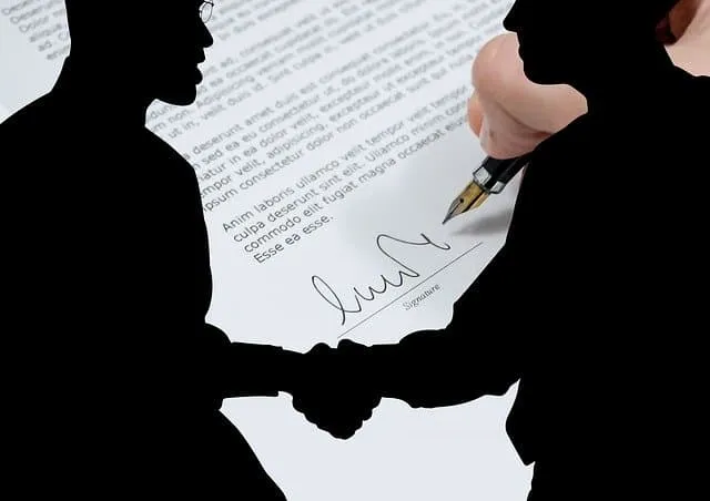 Handshake agreement signing with signature on document, business deal or contract, professional workplace, legal document, pa