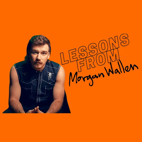 Innovative music artist Morgan Wallen with guitar on vibrant orange background, promoting lessons and musical insights.