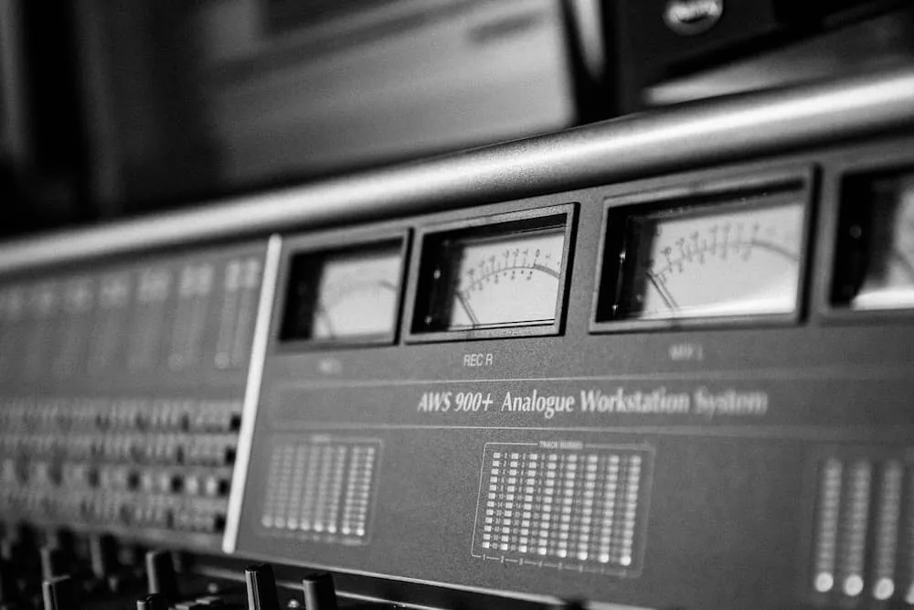 Vintage analog workstation system in black and white, featuring multiple meters and controls, used for professional audio rec