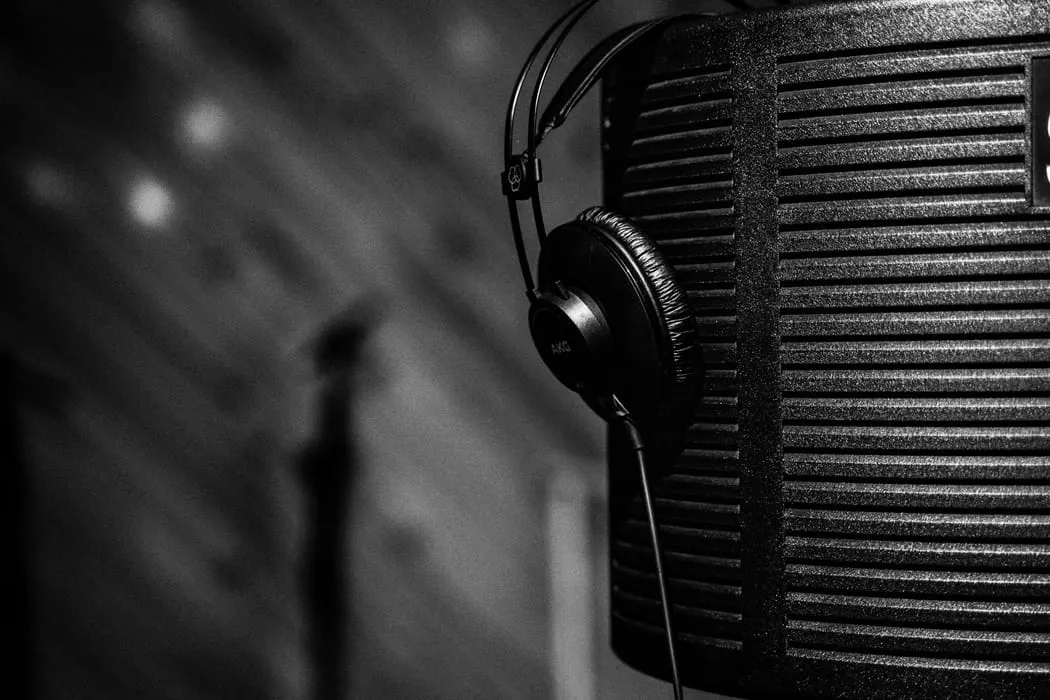 High-quality studio microphone and headphones setup for music recording or broadcasting, featuring professional audio equipme