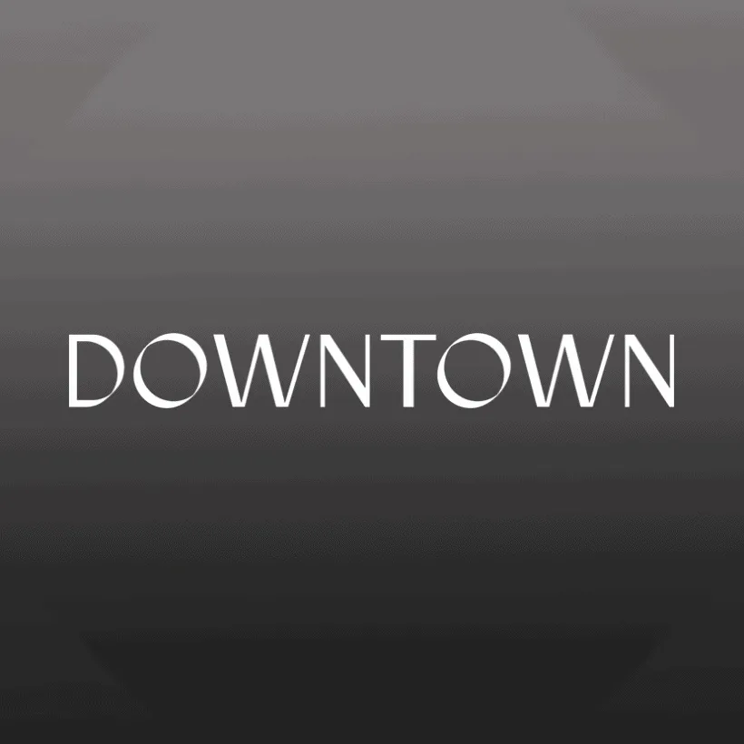 Downtown cityscape in black and white with modern architectural buildings and vibrant nightlife atmosphere.