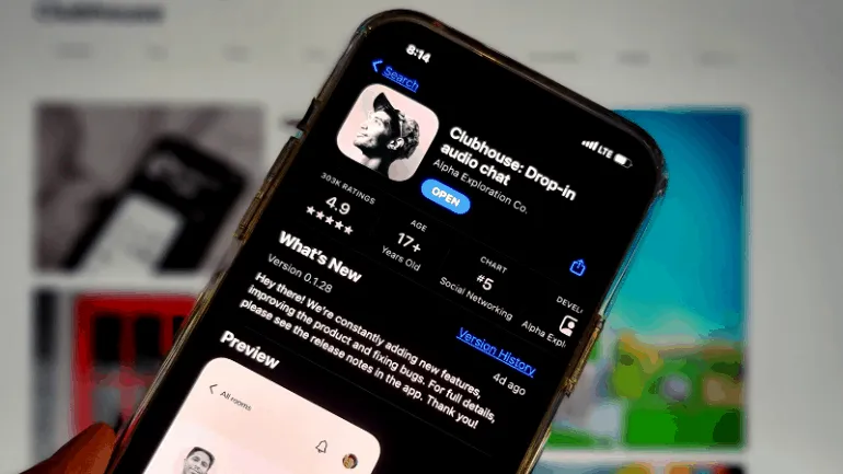Clubhouse audio chat app icon displayed on a smartphone screen in a digital setting, showcasing mobile social networking, liv