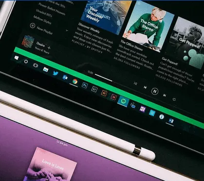 High-quality digital music and podcast platform interface displayed on a tablet screen showcasing Hypebot's latest updates an