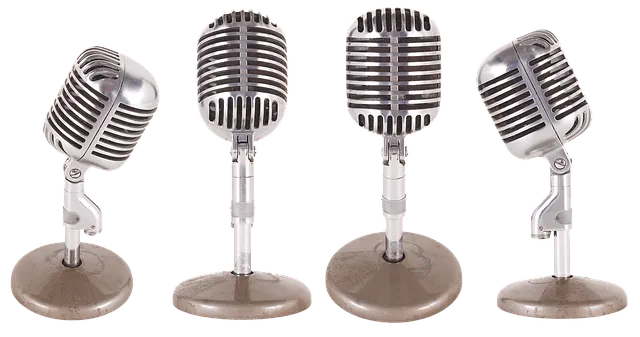 Vintage microphones on a stand, used for radio broadcasting and music performances, representing audio technology and live so