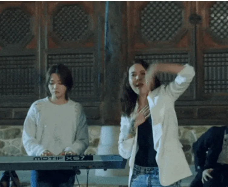 Keyboard player performing at Hypebot music event, lively concert scene, artist engaging crowd, live music performance, indus