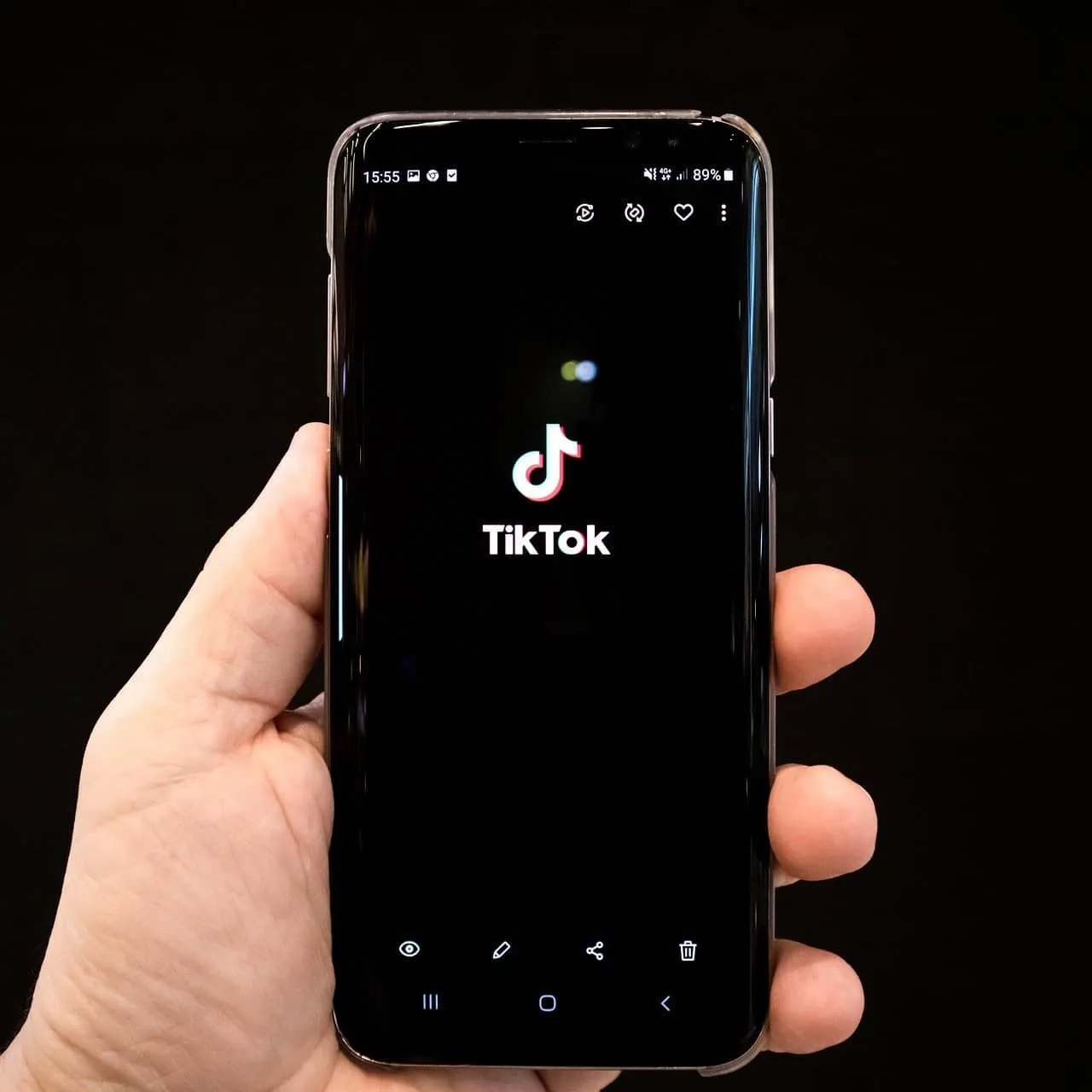 TikTok app on smartphone screen showcasing popular social media platform for music, videos, and digital content.