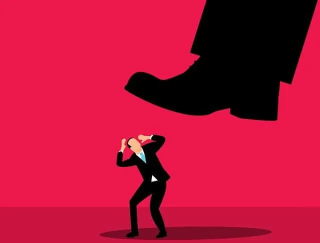 Boss stepping on a businessperson's head, representing workplace pressure or power imbalance.