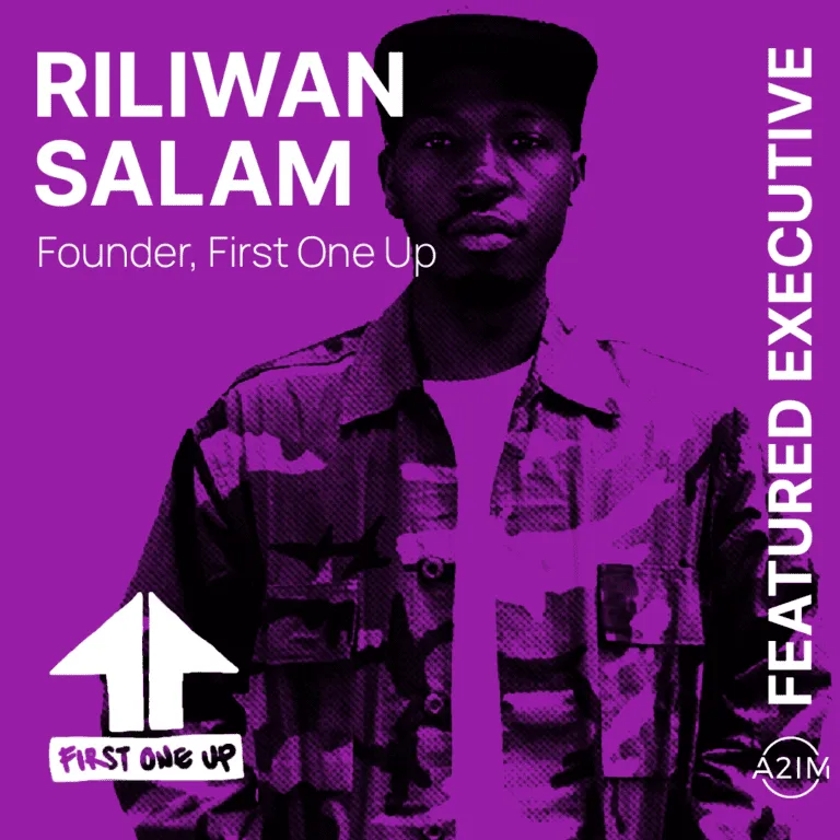 Riliwan Salam, founder of First One Up, featured as an executive in a vibrant purple-toned image highlighting leadership and