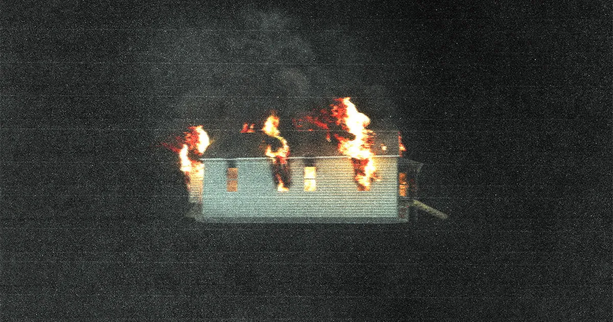 Fire damages house at night with flames and smoke in the dark, illustrating urgent home safety and emergency response, relate