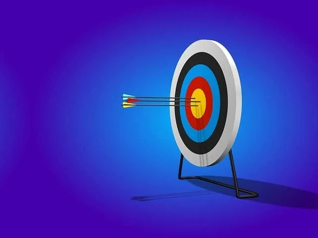 High-quality target with arrows hitting the bullseye on a colorful archery target, representing precision and goal achievemen