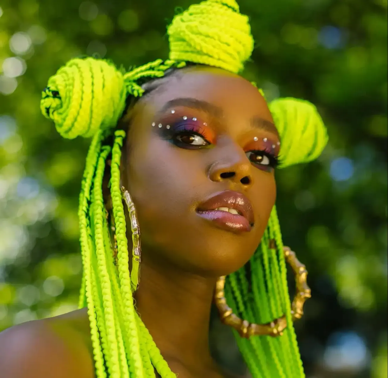 Vibrant neon green braided hairstyle with decorative beads and makeup, showcasing bold jewelry and artistic beauty look, set