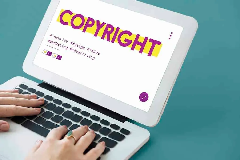 COPYRIGHT symbol on a laptop screen, emphasizing digital rights, intellectual property, and online content protection in the