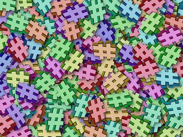 Hashtag-shaped colorful puzzle pieces scattered randomly, vibrant and visually engaging, symbolizing social media, digital co