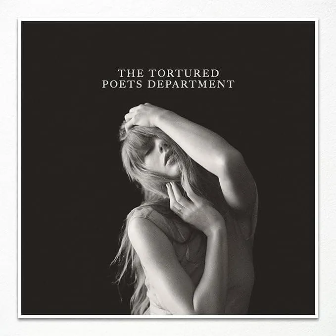 Photograph of a woman with long hair touching her face and head portrayed in black and white, album cover art for The Torture