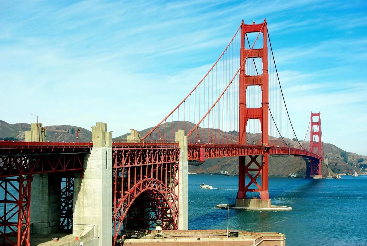 Golden Gate Bridge San Francisco iconic suspension bridge with scenic water view and hills in background, representing engine