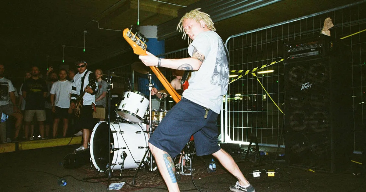 punk band playing in a DIY venue