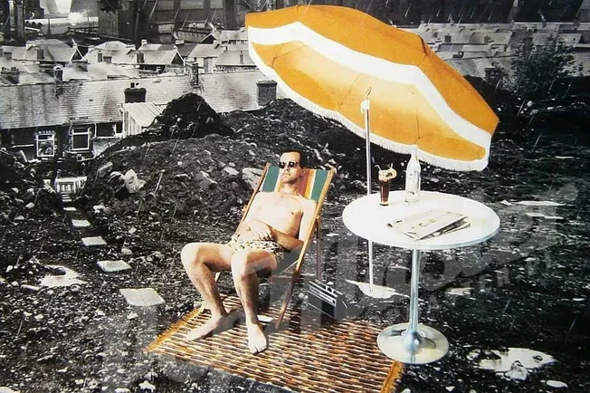 Relaxed man sunbathing on rooftop with umbrella and drinks, urban background, summer outdoor scene, music and leisure, lifest