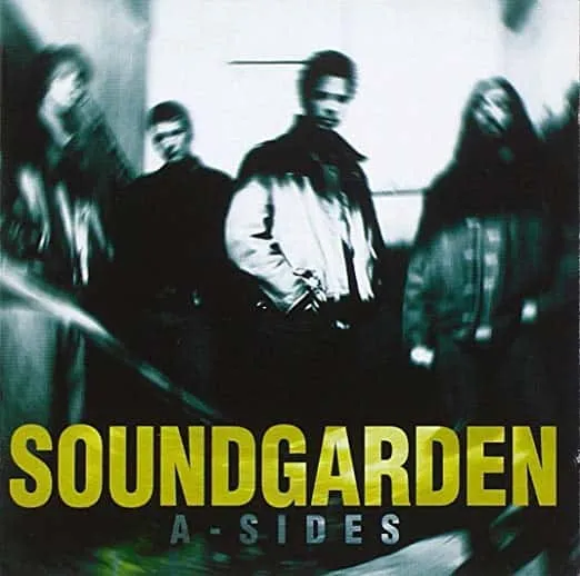 Soundgarden band members in a moody, blurred black and white photo for the album "A-Sides" promoting grunge music fans and al