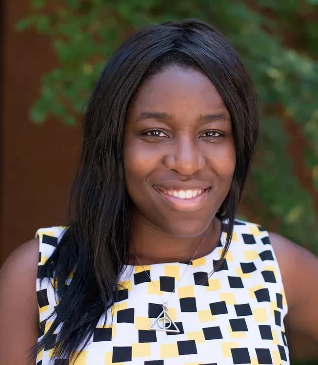 Professional woman smiling outdoors in summer fashion, confident and stylish, vibrant environment, lifestyle, diverse woman p