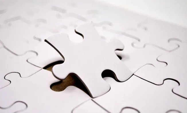Missing puzzle piece on white background, symbolizing problem-solving, data fitting, or completing the big picture in busines