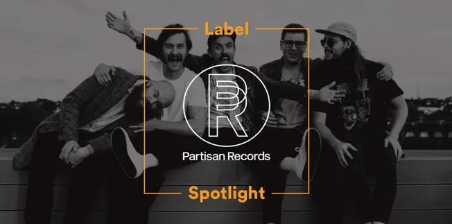 Friends group photo on a rooftop with Partisan Records logo, music branding, and modern entertainment vibe.