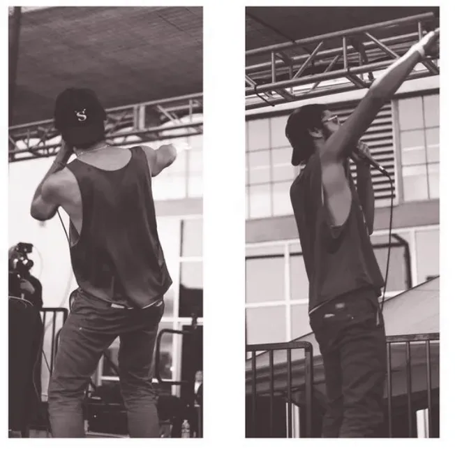 DJ performing live at a music event, showcasing turntables and music equipment for DJ performance, with a focus on music indu