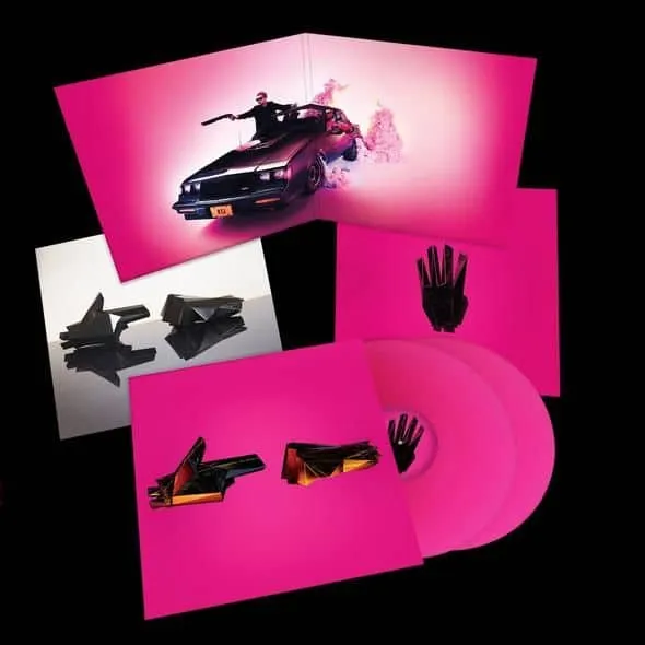 A futuristic pink-themed album cover featuring a stylized car, abstract black hand sculptures, and modern graphic elements fo