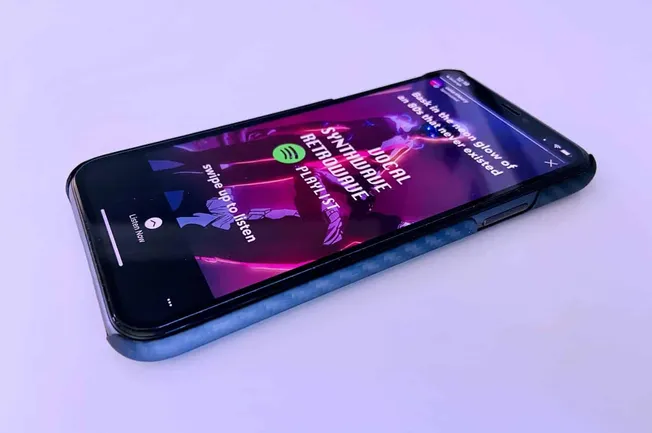 AI-powered music streaming app on smartphone with neon-themed interface, highlighting digital music, playlists, and personali
