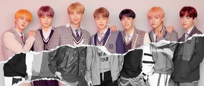 K-pop boy band members in stylish school uniform-inspired outfits, posing together for a photo representing modern music cult