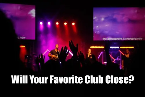 Bright concert stage with performers and colorful lighting, highlighting a lively music event at a nightclub or concert venue