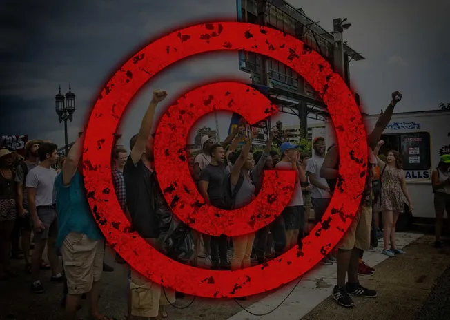 Protest crowd at a rally with a large red Target logo overlay, emphasizing activism, social movements, and community engageme