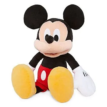 Soft plush Mickey Mouse toy with classic red shorts, large yellow shoes, and signature black ears, ideal for children and Dis