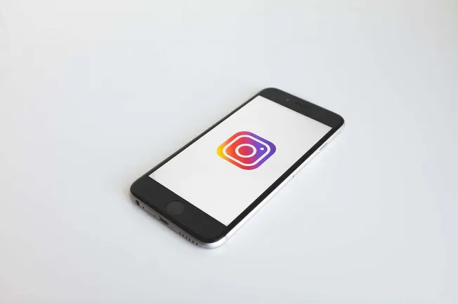 Instagram logo displayed on a smartphone screen, highlighting social media marketing and digital branding strategies.